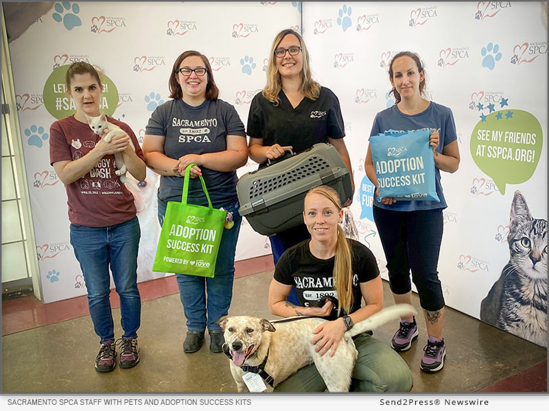 Staff from the Sacramento SPCA gather with pets and the Adoption Success Kits