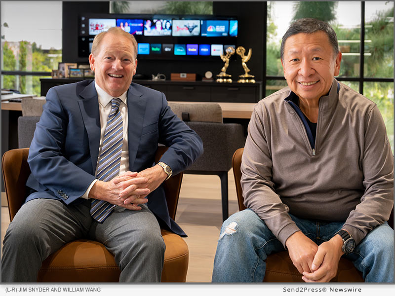 Jim Snyder, CEO of Tidemark Real Estate Services, poses with William Wang